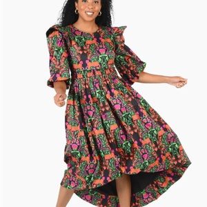 Emily McCarthy lounging leopard Iris dress